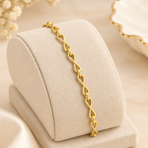 Golden Infinity Bracelet on Ivory Display